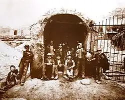 Carusi at the entrance of a sulfur mine shaft; 1899.