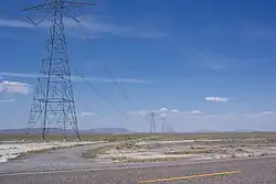 Path 27 as seen on US 50 in Utah. An AC transmission line has since been built alongside this segment of the HVDC line.