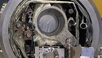 Cross section of the cryomodule. A large tube at the center is Helium gas return pipe. The closed tube below it is the beam axis.