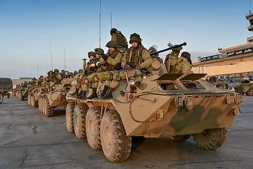 Russian Engineer Troops ride desant aboard BTR-82As in Aleppo, Syria, in December 2016