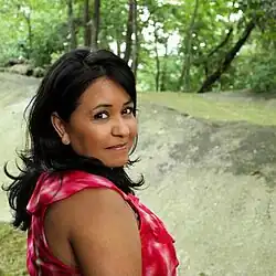 Irene Estrada wearing a red dress