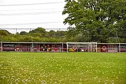View of the North End of Ironmould Lane with the 1957 Flags displayed behind the goal.