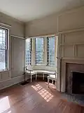 Interior southeast corner at second floor showing the bay window with seating, 2025