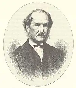 Portrait photo of a man around 60 years of age