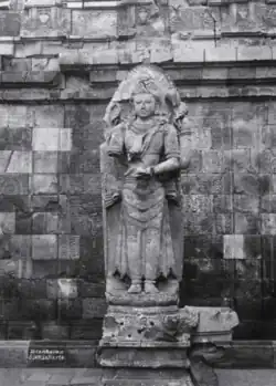 Black and white photograph of statue depicting Queen Isyana