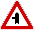 Junction with a minor side-road from left (also uses )