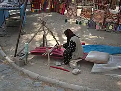 Horizontal nomad loom; weaving, not pile-knotting