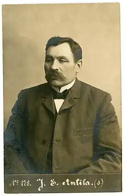 Sepia photograph of Juho Erkki Antila in a suit