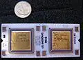 Top side of J-11 microprocessor hybrid. DC335 control chip on left, DC334 data path chip on right. US dime for scale.