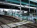 Close up of the level crossing and ramp leading to a platform.