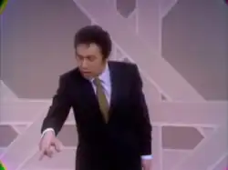 Jackie Mason gestures to a member of the audience during the Smothers Brothers Comedy Hour, January 19, 1969. Mason is pointing with his middle finger.