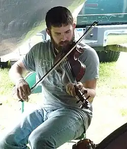 Jake Krack playing the fiddle in 2009