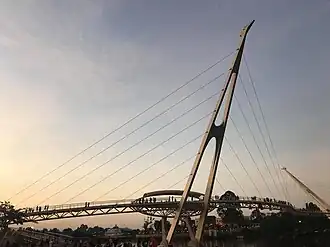 Darul Hana Bridge at dusk, with The Astana seen visible below