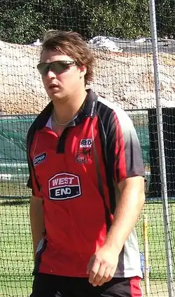 Photograph of Smith wearing glasses and facing left