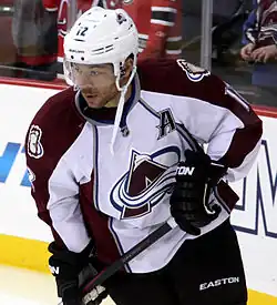 Iginla stares to his right as he stands on the ice surface during a pre-game warm-up.