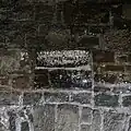 685 Dedication stone situated above western tower arch