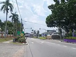 Traffic lights at a street in Jasin town, the former headquarters of the Municipal Council is on the right.