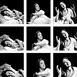 Women sleeping and smiling, then rising with serious face, then smiling with hands up.