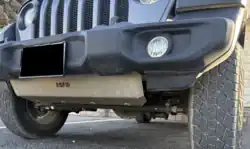 Aftermarket skid plate on a Jeep Wrangler JL