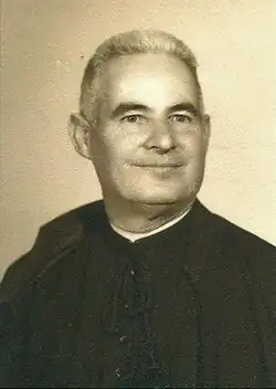 Portrait photograph of Arnal, wearing a cassock