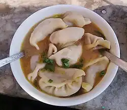 Broth made from achar used for jhol momo