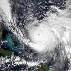 An intense hurricane with a clear circular eye and curved rainbands on its eastern flank.