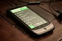 Image 2A smartphone displaying playlists on Spotify, 2010. The streaming service became a dominant and redefining platform for music consumption through the decade. (from Album era)