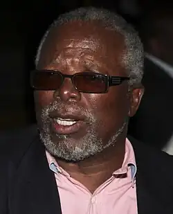 A smiling John Kani