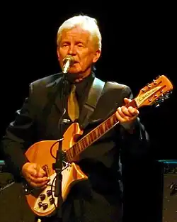 McNally in 2015, performing with his Rickenbacker 620/12 guitar.