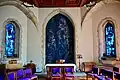 The Trinity Chapel, with dossal and windows designed by John Piper.