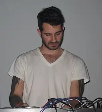 Joshua Eustis performing with Telefon Tel Aviv in 2009