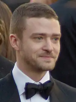 A profile picture of a young blonde man who is looking forward