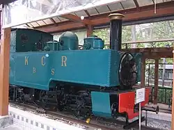 Blue-green locomotive in a museum