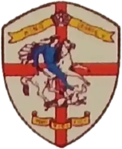 The early badge featuring the cross symbol.