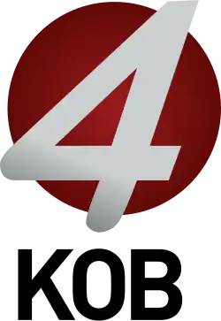 A silver italicized 4 sitting atop a smaller red circle, with black letters "KOB" beneath