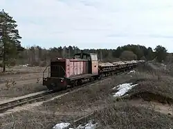Locomotive TU7-1703 with freight train