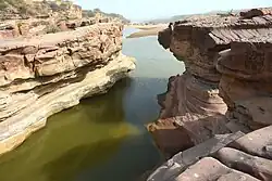 Eroded badlands with layered earth formations