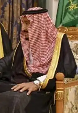Image 2Red and white keffiyeh commonly worn in the desert held with a black agal (from Culture of Saudi Arabia)