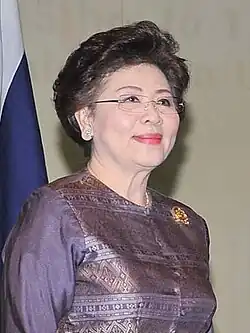 A picture of a woman in a purple formal top