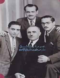 Sheikh Kamal al-Din bin Sheikh Ali Tahboub al-Marwani (b. 1898 CE), the Sheikh of Sheikhs of the Ibrahimi Mosque in Hebron, sitting in the middle among his sons: The upper one is Jamil, to his left is Khalil, and to his right is Adib Pasha