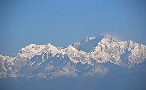 Himalayan massif with snow-covered peaks under a clear sky
