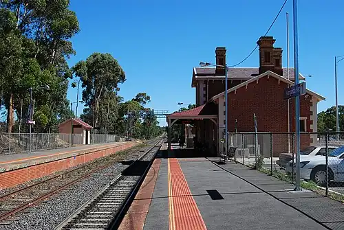 View from Platform 1 looking south, showing the station buildings on each platform