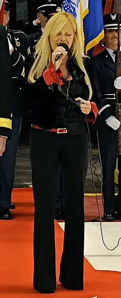 Newman singing "The Star-Spangled Banner" before a Detroit Red Wings game at Joe Louis Arena on November 11, 2010