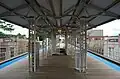 The Kedzie station has a wide-wooden platform with passenger shelters