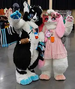 two people posing in kemono fursuits
