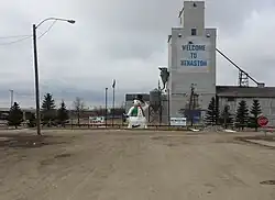 Snowman and grain elevator in downtown Kenaston