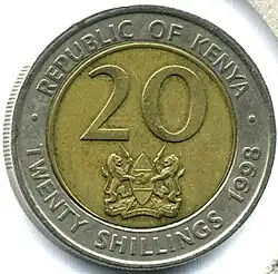 Face of coin showing figure 20 and the coat of arms of Kenya, surrounded by the words REPUBLIC OF KENYA, TWENTY SHILLINGS