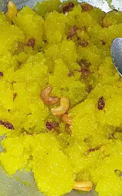 Typical Karnataka-style lemon-coloured kesari bhath with cashew nuts