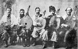 Ukrainian lirnyk with kobzars, Okhtyrka, 1911