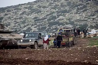 Israeli tank training in the fields of Khirbet Ibziq Palestinian village, forcing residents to leave their homes, December 2021.